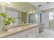 Large bathroom with double vanity, ample counter space, and well-lit mirrors at 8435 Hilltop Ln, Martinsville, IN 46151