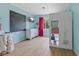 Bright and cheerful bedroom with stylish storage and a large chalkboard wall at 8435 Hilltop Ln, Martinsville, IN 46151