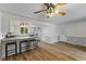 Eat-in kitchen is bright and features white cabinets, stainless steel appliances and a breakfast bar with seating for three at 8435 Hilltop Ln, Martinsville, IN 46151