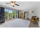 Cozy room filled with natural light, features hardwood floors, and access to a balcony through large sliding glass doors at 8435 Hilltop Ln, Martinsville, IN 46151