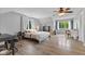 Spacious main bedroom with two windows, wood floors and ample natural light at 8435 Hilltop Ln, Martinsville, IN 46151