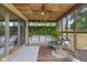 Relaxing screened porch featuring comfortable seating, unique decor, and a charming outdoor ambiance at 8435 Hilltop Ln, Martinsville, IN 46151