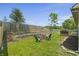 Spacious backyard with lush green grass and mature trees, perfect for outdoor activities at 8526 Country Meadows Dr, Indianapolis, IN 46234
