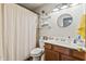 Well-lit bathroom featuring a shower with curtain, vanity, and modern fixtures at 8526 Country Meadows Dr, Indianapolis, IN 46234