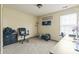 Bright bedroom featuring a window for natural light, a desk, and comfortable carpeting at 8526 Country Meadows Dr, Indianapolis, IN 46234