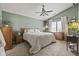 Bedroom features a large bed, neutral tones, and plenty of natural light at 8526 Country Meadows Dr, Indianapolis, IN 46234