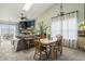 Bright and airy dining area featuring vaulted ceilings, fireplace, and lots of natural light at 8526 Country Meadows Dr, Indianapolis, IN 46234
