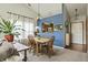 Inviting dining area with table and chairs is a bright open space with views of the kitchen and living room at 8526 Country Meadows Dr, Indianapolis, IN 46234