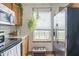 Cozy kitchen features stainless steel appliances, natural light, and charming decor at 8526 Country Meadows Dr, Indianapolis, IN 46234