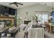 Cozy living room features a brick fireplace, plush sofa, and abundant natural light at 8526 Country Meadows Dr, Indianapolis, IN 46234