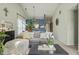 Bright living area features a large sofa, accent pillows, and stylish decor at 8526 Country Meadows Dr, Indianapolis, IN 46234