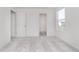 A simple bedroom with light gray carpet, white walls, and a view of the outside through a window at 876 Cowley Dr, Westfield, IN 46074