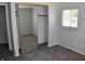 Bright bedroom with mirrored closet doors and a window at 9016 Neptune Dr, Indianapolis, IN 46229
