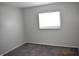 Cozy bedroom with carpeting, neutral walls, and a bright window at 9016 Neptune Dr, Indianapolis, IN 46229