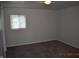 This is an airy bedroom with a window and neutral carpet at 9016 Neptune Dr, Indianapolis, IN 46229