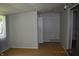 The bonus room features laminate floors and has a door to the exterior at 9016 Neptune Dr, Indianapolis, IN 46229