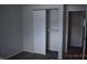 Spacious closet with sliding doors, ample storage and adjacent doorway to another room at 9016 Neptune Dr, Indianapolis, IN 46229