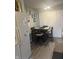 Bright eat-in kitchen features a modern ceiling fan and a dining table with chairs at 9016 Neptune Dr, Indianapolis, IN 46229