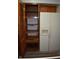 Spacious pantry with white refrigerator and side by side freezer, as well as ample storage at 9016 Neptune Dr, Indianapolis, IN 46229