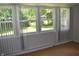 This sun room has natural light exposure due to the windows lining the room at 9016 Neptune Dr, Indianapolis, IN 46229
