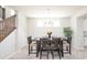 Comfortable dining room featuring a rustic dining table, chairs, and staircase to upper floors at 9248 Hawley Dr, Indianapolis, IN 46216