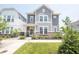 Charming two-story home with manicured front yard, lush green lawn, and inviting walkway at 9248 Hawley Dr, Indianapolis, IN 46216