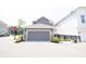 Detached two-car garage with gray siding in a neighborhood setting at 9248 Hawley Dr, Indianapolis, IN 46216
