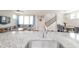 Modern kitchen with granite counters, stainless steel sink, and open view to the living room at 9248 Hawley Dr, Indianapolis, IN 46216