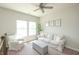 Comfortable living room with bright windows, a neutral sofa, accent chair and decorative artwork at 9248 Hawley Dr, Indianapolis, IN 46216