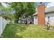 Backyard featuring a patio with a pergola, privacy fence, and a spacious grassy area at 9256 Colgate St, Indianapolis, IN 46268
