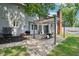 Backyard patio with pergola features a seating area, grill, and access to the home at 9256 Colgate St, Indianapolis, IN 46268