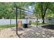 Backyard patio with pergola, fire pit, and chairs, ideal for outdoor relaxation at 9256 Colgate St, Indianapolis, IN 46268