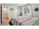 Bedroom features include closet, natural light, and soothing wall art at 9256 Colgate St, Indianapolis, IN 46268