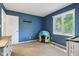 The bedroom features light-blue walls and includes a large, naturally lit window at 9256 Colgate St, Indianapolis, IN 46268