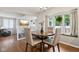 Charming dining area with a round wood table, stylish chairs, and natural light at 9256 Colgate St, Indianapolis, IN 46268
