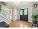 Foyer with hardwood floors, double door entry, staircase and gray walls at 9256 Colgate St, Indianapolis, IN 46268