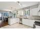 Bright, updated kitchen with white cabinetry, stainless steel appliances, and quartz countertops at 9256 Colgate St, Indianapolis, IN 46268
