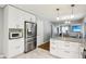 Open-concept kitchen with stainless appliances, a large island, and sleek countertops, great for cooking at 9256 Colgate St, Indianapolis, IN 46268