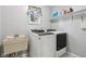 Laundry room featuring a washing machine, dryer, and utility sink at 9256 Colgate St, Indianapolis, IN 46268