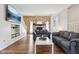 Inviting living room features a stone fireplace, wood floors, and comfortable seating for a cozy gathering at 9256 Colgate St, Indianapolis, IN 46268