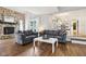 Living room featuring hardwood floors, two couches and open access to the kitchen at 9256 Colgate St, Indianapolis, IN 46268