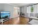 Cozy living room with hardwood floors, gray walls, and a view into the foyer at 9256 Colgate St, Indianapolis, IN 46268