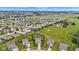Expansive aerial view of a community with houses on large lots, featuring green fields and surrounding landscape at 937 Maple Stone Dr, Greenwood, IN 46143