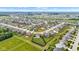 Community aerial view highlighting a large, fenced backyard adjacent to an open field, providing privacy at 937 Maple Stone Dr, Greenwood, IN 46143