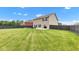 Spacious backyard with a patio area, ideal for relaxing and entertaining at 937 Maple Stone Dr, Greenwood, IN 46143