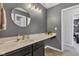 Beautiful bathroom with a large round mirror, modern vanity, and soft lighting at 937 Maple Stone Dr, Greenwood, IN 46143