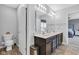 Clean bathroom with a double sink vanity and commode, providing a functional and relaxing space at 937 Maple Stone Dr, Greenwood, IN 46143