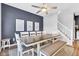 An open-concept dining area with a stylish table, seating, and stair access nearby at 937 Maple Stone Dr, Greenwood, IN 46143