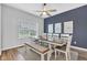 Bright dining area with a large table, modern chairs, and an attractive accent wall at 937 Maple Stone Dr, Greenwood, IN 46143
