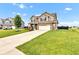 A view of a two-story home with neutral siding, a two-car garage, and a neatly maintained lawn at 937 Maple Stone Dr, Greenwood, IN 46143